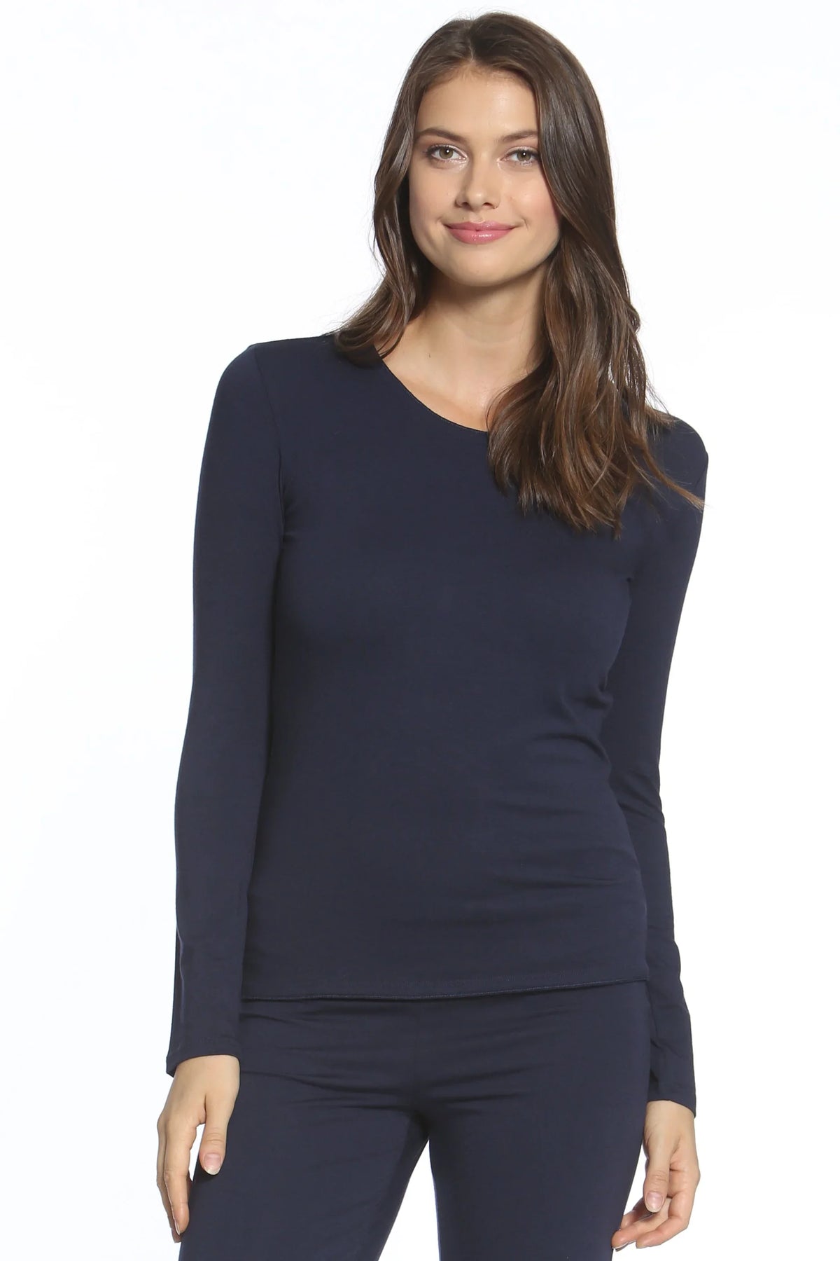 Woman wearing navy blue Pima cotton long sleeve loungewear set on white background