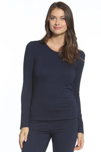 Woman wearing navy blue Pima cotton long sleeve loungewear set on white background