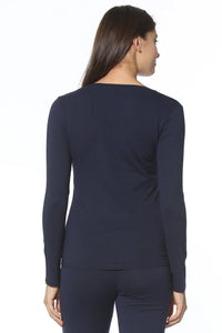 Woman wearing navy long sleeve loungewear top and pants set, back view