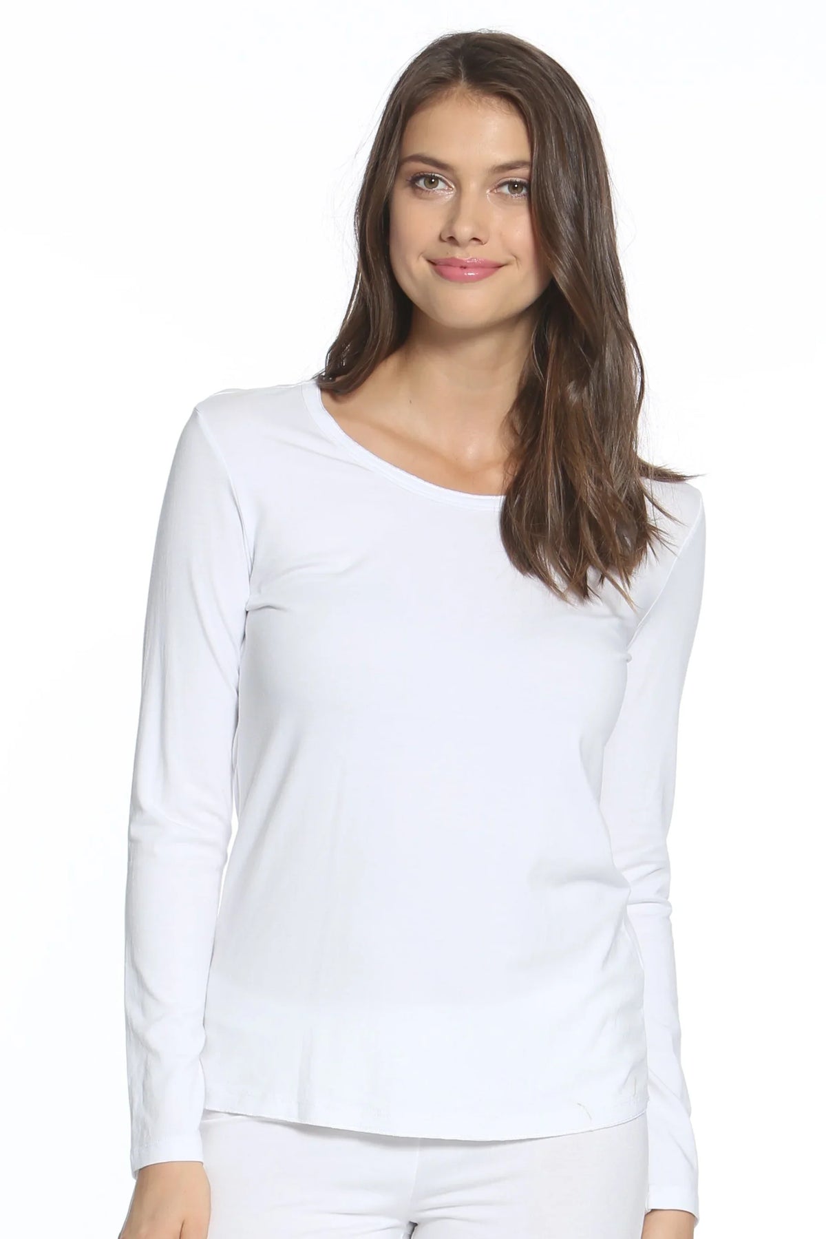 Woman wearing white long sleeve Pima cotton loungewear top, relaxed fit, minimal design