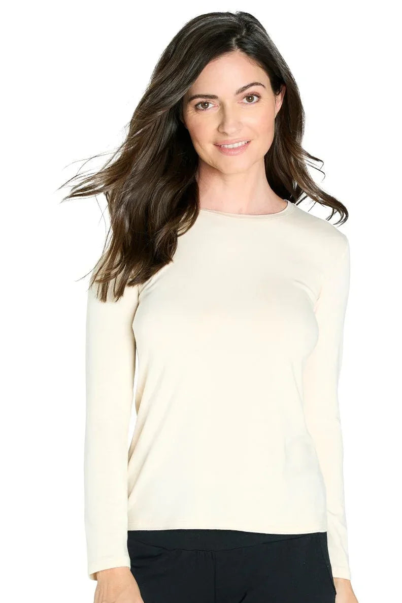 Woman wearing a long sleeve almond beige Pima cotton loungewear top