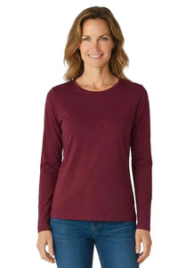 Woman wearing a long sleeve burgundy Pima cotton loungewear tee and blue jeans