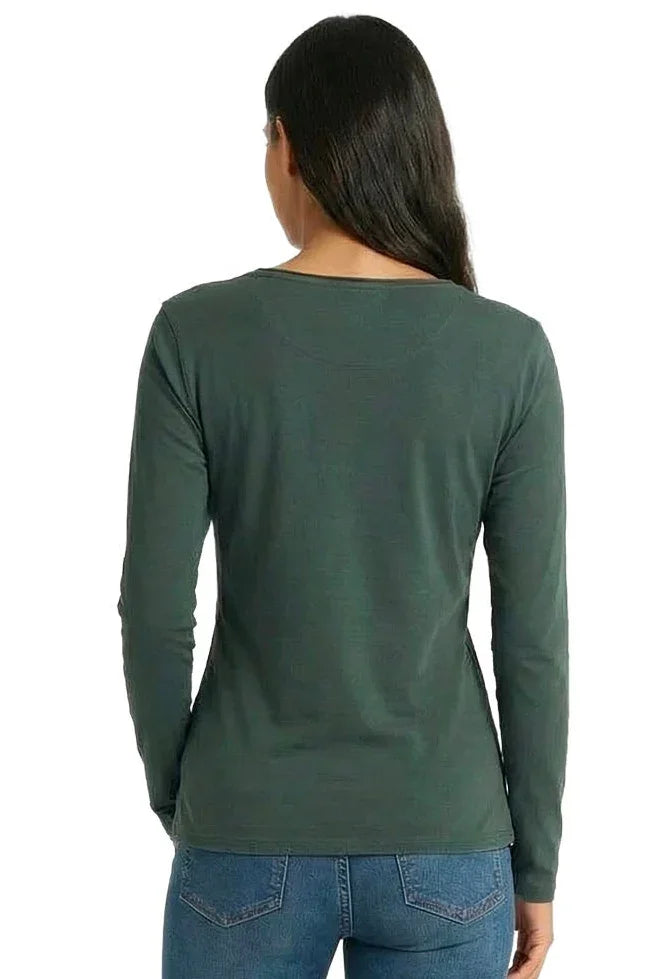 Woman wearing long sleeve dark green loungewear top and blue jeans, back view