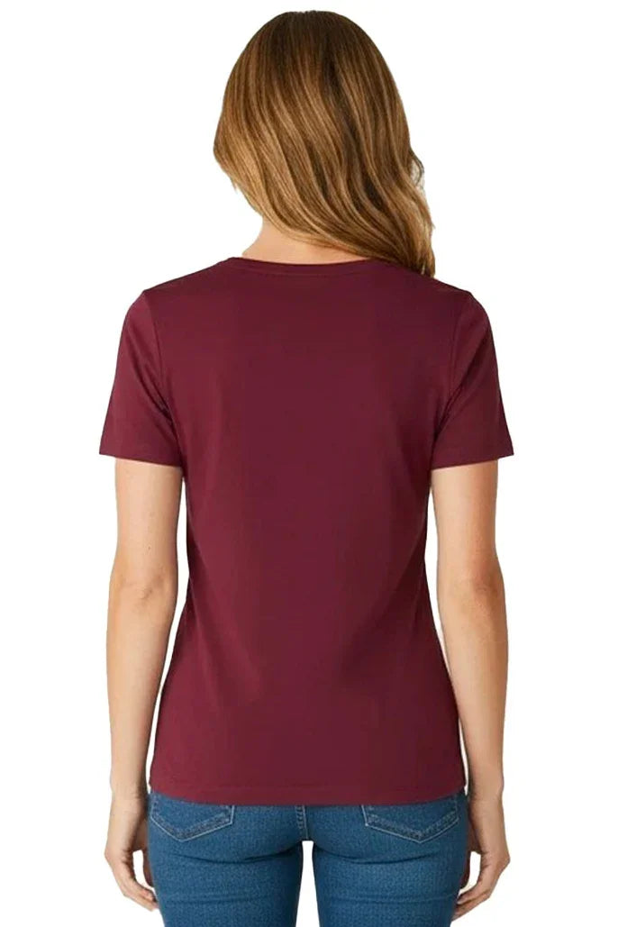 Back view of woman in a burgundy Pima cotton short sleeve tee and blue jeans