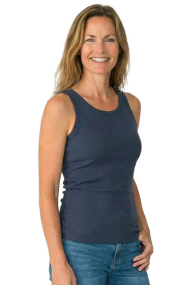 Woman wearing a steel blue ribbed tank top and blue jeans, casual sleepwear style