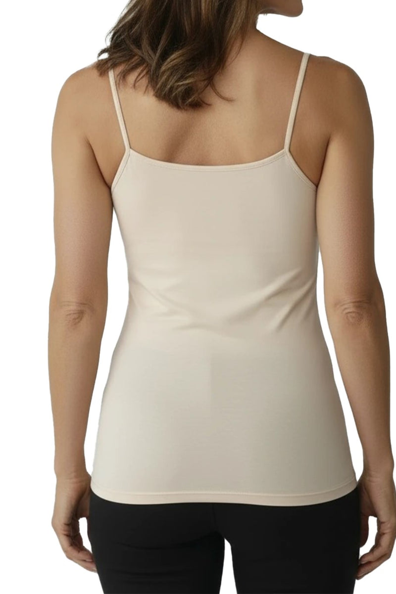 Beige spaghetti strap camisole worn by a woman on a white background. Back side view