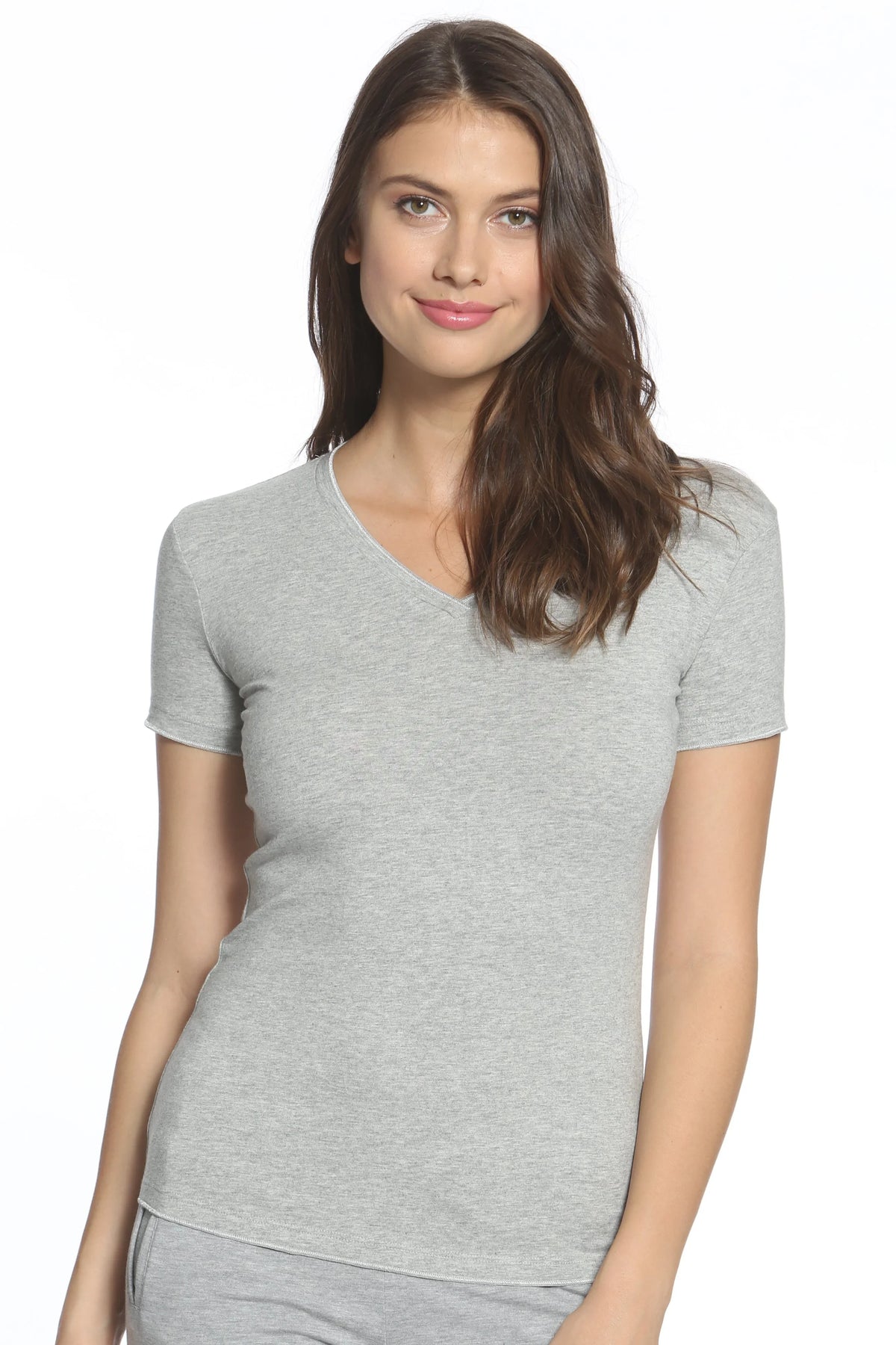 Woman wearing a heather grey short sleeve V-neck loungewear tee on white background