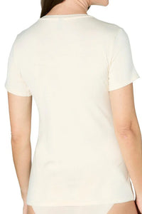 Back view of a woman wearing a short sleeve almond beige Pima cotton tee and briefs