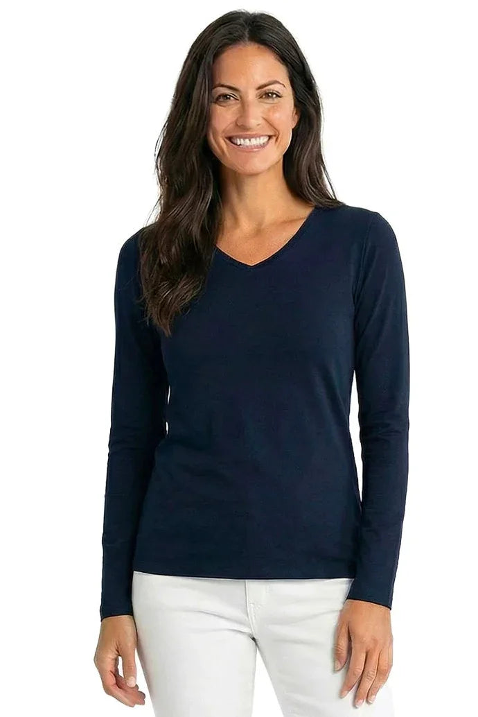 Woman wearing a black long sleeve V-neck Pima cotton loungewear top and white pants
