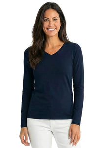 Woman wearing a black long sleeve V-neck Pima cotton loungewear top and white pants