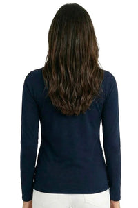 Woman in navy long sleeve loungewear top and white pants, back view, relaxed fit