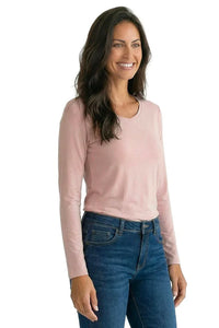 Woman wearing a shell pink long sleeve Pima cotton tee with blue jeans