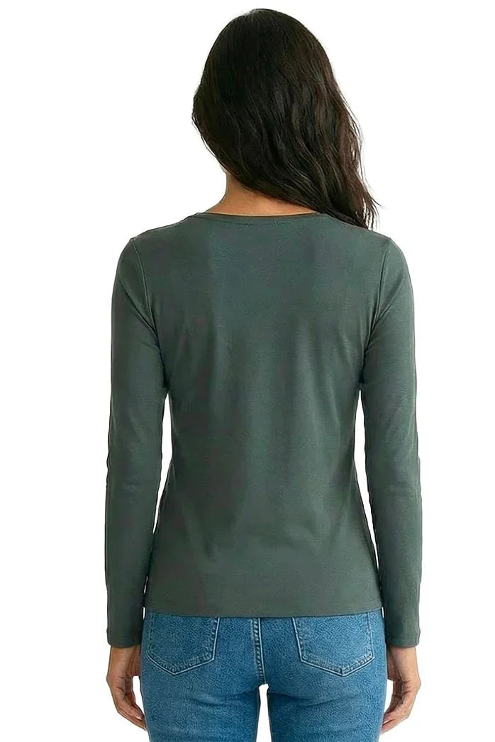 Back view of woman in green long sleeve Pima cotton tee and blue jeans