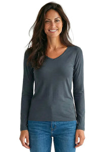 Woman wearing a steel blue long sleeve Pima cotton loungewear top and blue jeans