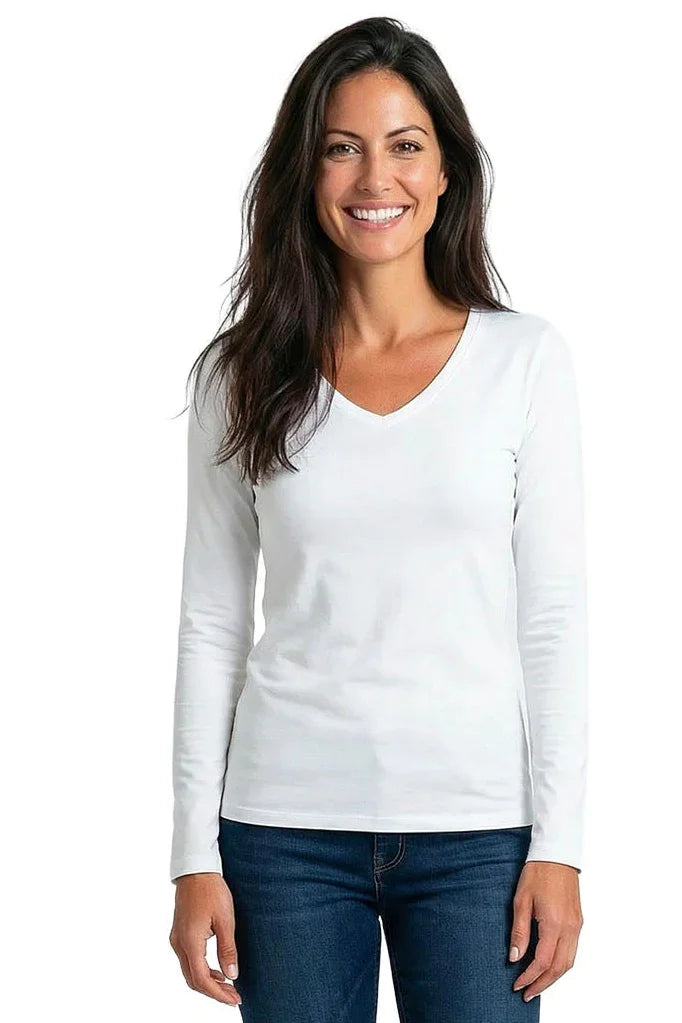 Woman wearing a white long sleeve V-neck Pima cotton tee and blue jeans, smiling