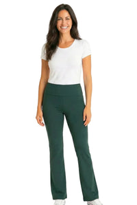 Woman wearing white short sleeve tee and dark green lounge pants, smiling, on white background