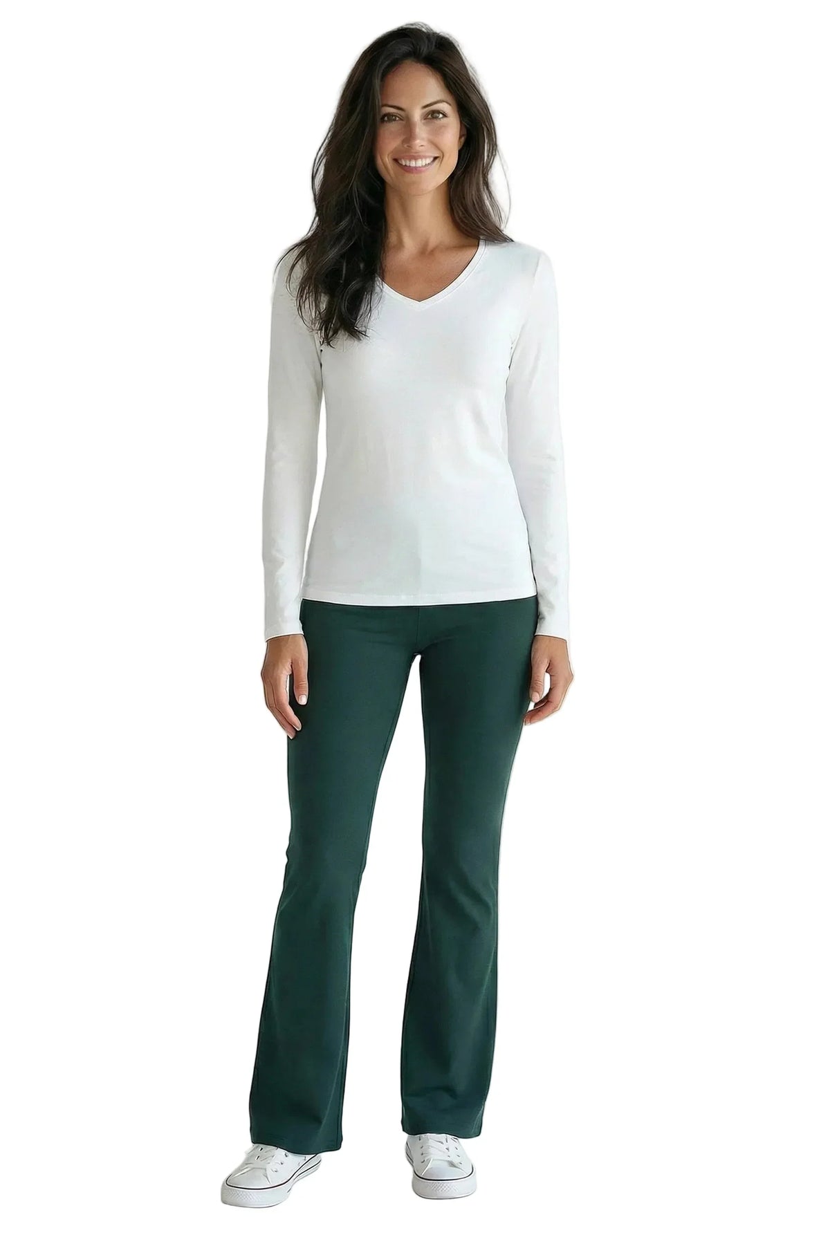 Woman wearing a white long sleeve tee and dark green lounge pants, casual style