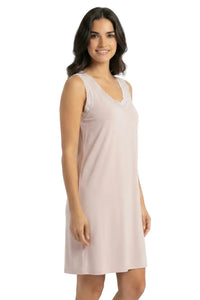 Woman wearing light pink sleeveless Pima cotton loungewear nightgown with lace trim