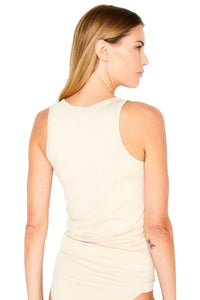 Woman showing back of beige ribbed tank top loungewear, relaxed fit, neutral background