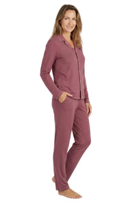 Woman wearing rosewood pink Pima cotton loungewear pajama set, long sleeve and pants