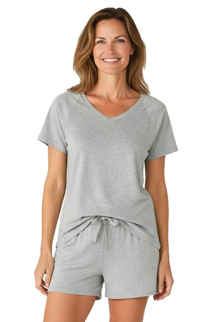 Woman wearing heather gray Pima cotton loungewear set with V-neck tee and drawstring shorts
