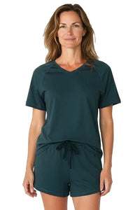 Woman wearing dark green Pima cotton loungewear short set with V-neck top