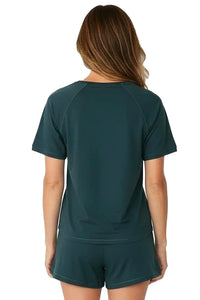 Woman wearing dark green Pima cotton loungewear short sleeve top and shorts set