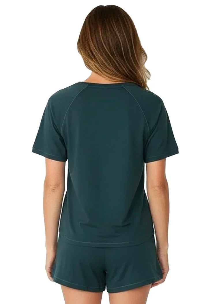 Woman wearing dark green Pima cotton loungewear short sleeve top and shorts set