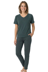 Woman wearing dark green Pima cotton loungewear set with short sleeve tee and pants