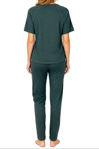 Back view of woman wearing dark green short-sleeve top and matching pants loungewear set