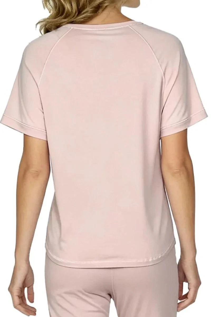 Back view of woman in soft pink short sleeve Pima cotton loungewear set