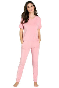 Woman wearing pink Pima cotton loungewear set with short sleeves and long pants