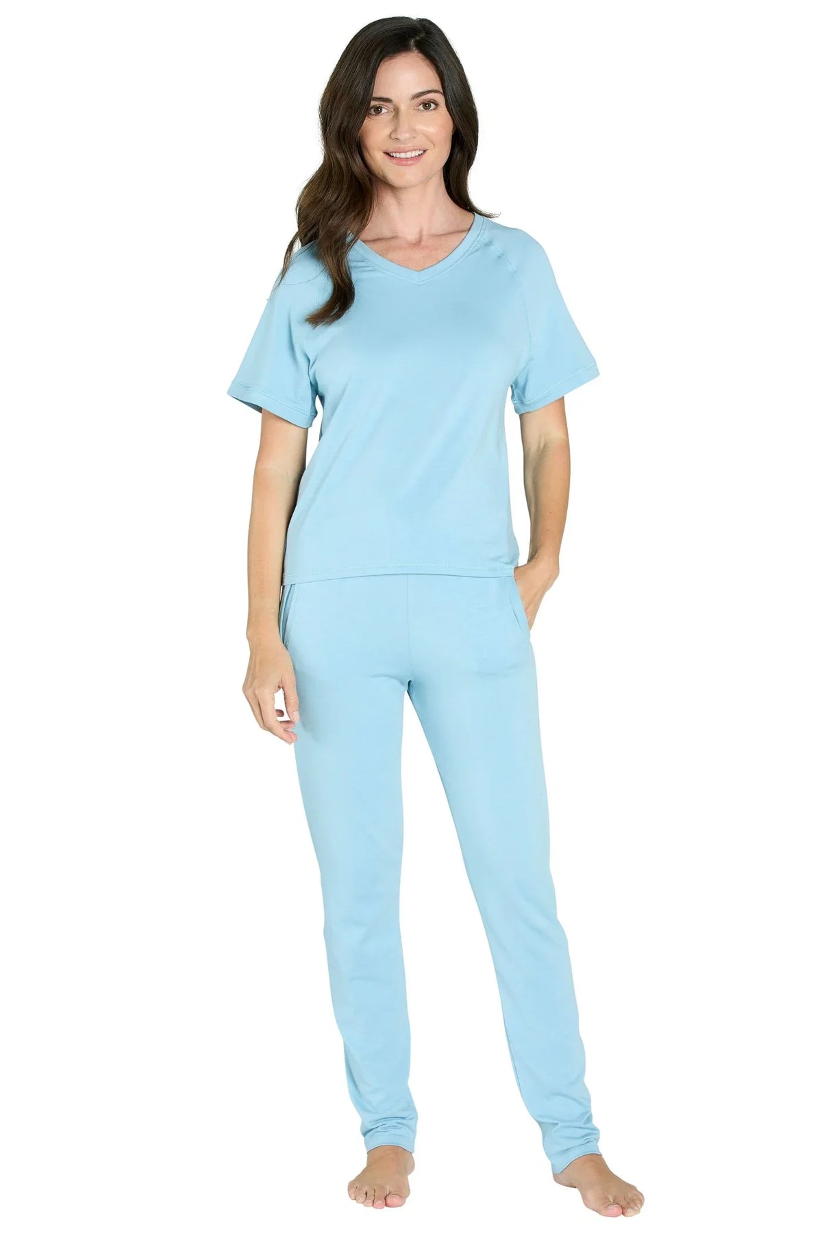 Woman wearing light blue Pima cotton loungewear set with short sleeves and relaxed fit.