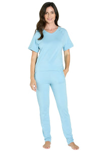 Woman wearing light blue Pima cotton loungewear set with short sleeves and relaxed fit.