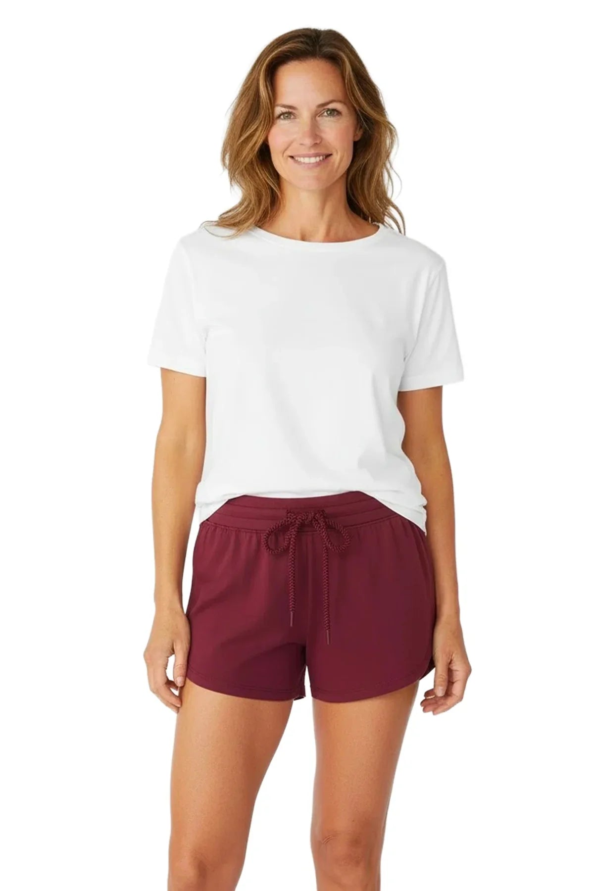 Woman wearing a white Pima cotton t-shirt and burgundy loungewear shorts