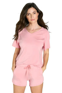 Woman wearing pink Pima cotton loungewear short sleeve top and drawstring shorts
