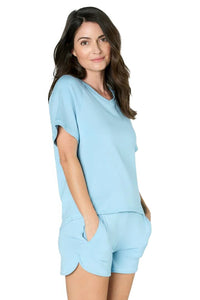 Woman wearing sky blue Pima cotton loungewear set with short sleeves and shorts