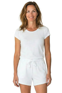 Woman wearing white Pima cotton loungewear set with short sleeves and drawstring shorts