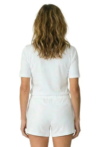 Woman wearing white Pima cotton loungewear sleep set, viewed from the back