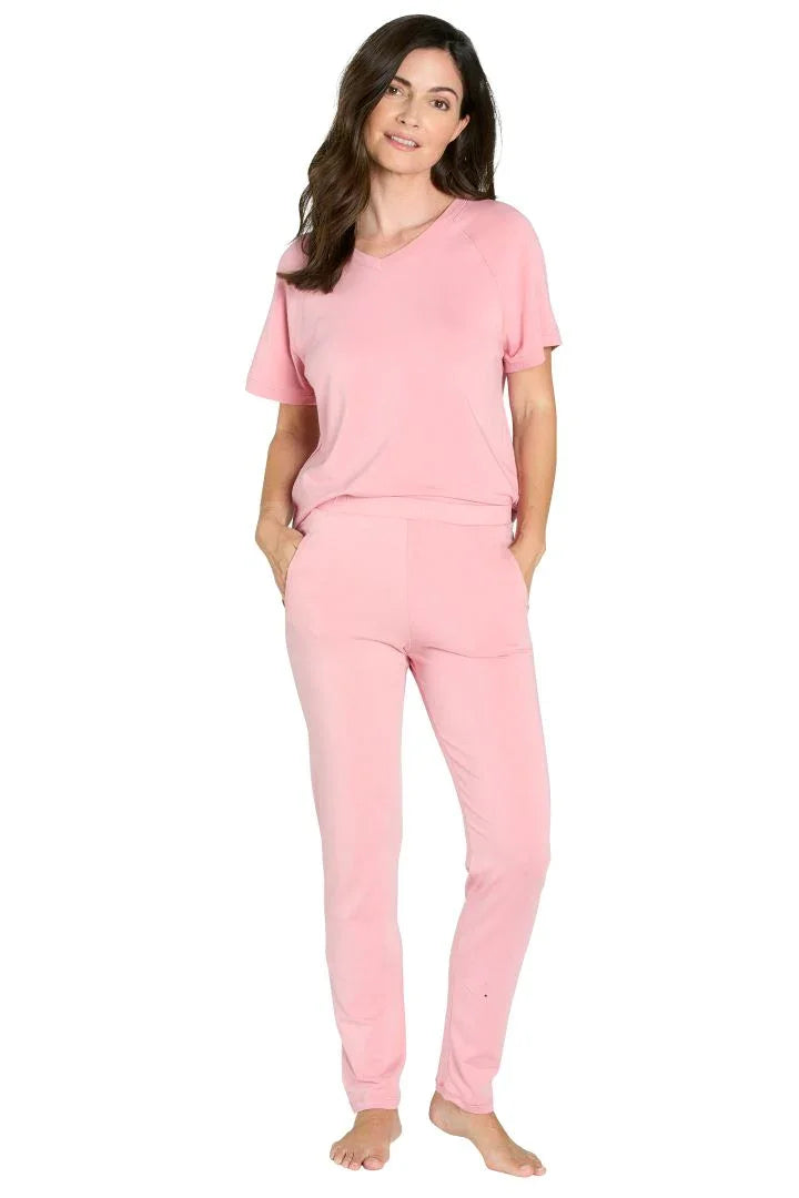 Woman wearing light pink Pima cotton loungewear set with short sleeves and jogger pants