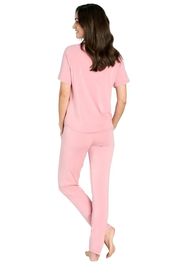 Woman wearing pink Pima cotton loungewear pajama set, short sleeve top and pants