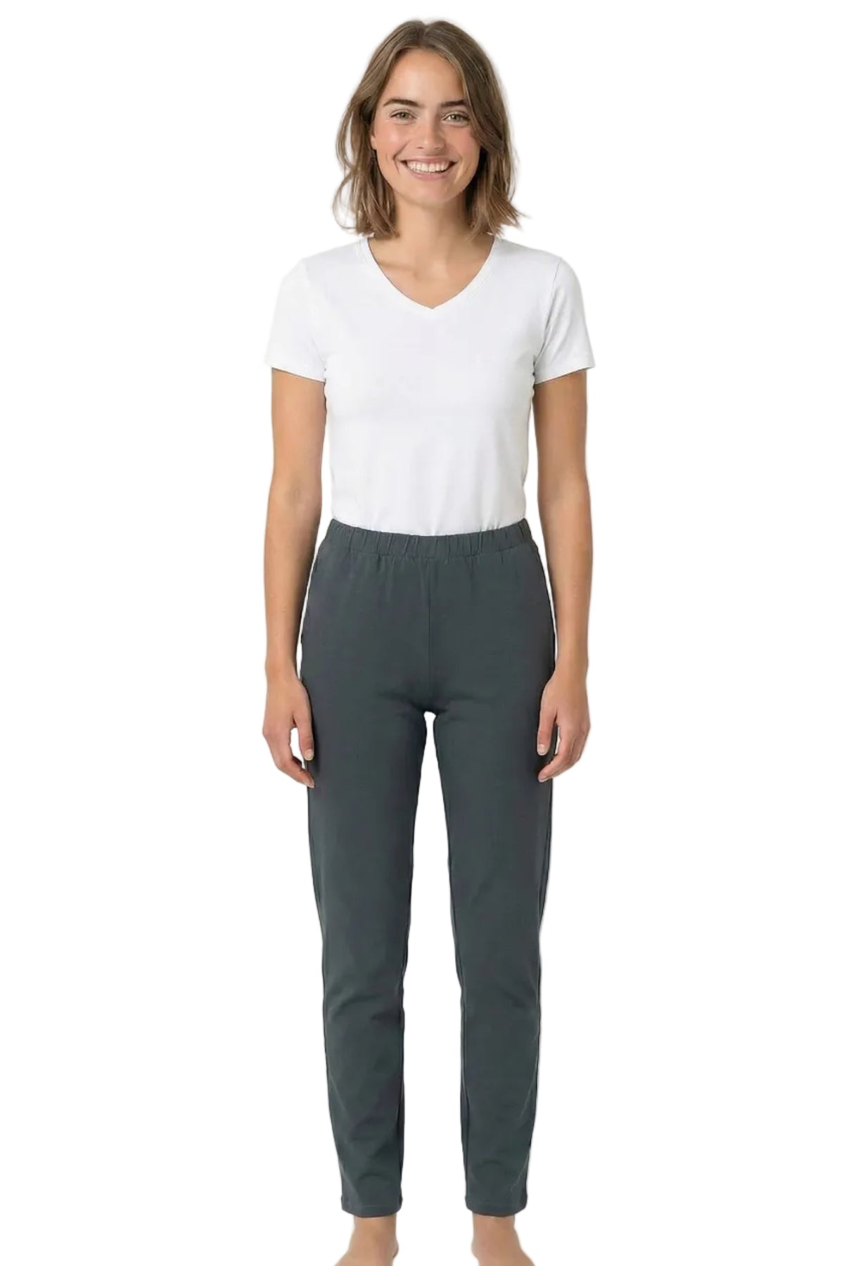 Woman wearing a white V-neck tee and dark grey lounge pants, barefoot, on white background