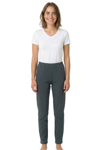 Woman wearing a white V-neck tee and dark grey lounge pants, barefoot, on white background