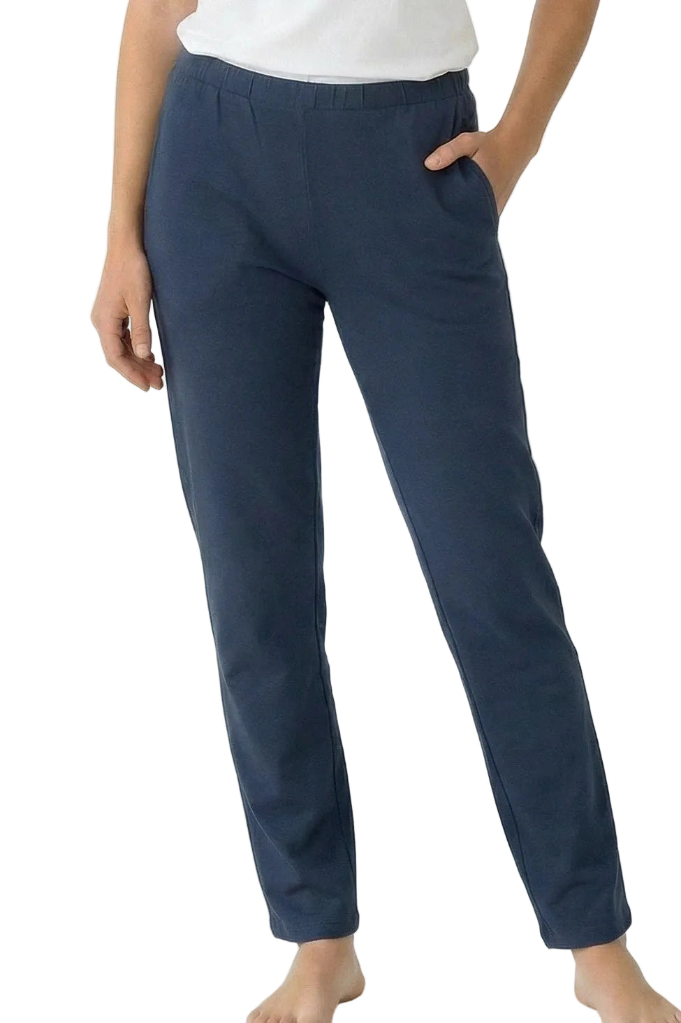 Woman wearing steel blue cotton lounge pants with elastic waistband and side pockets