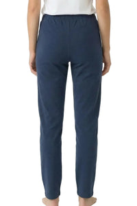 Back view of blue cotton lounge pants with elastic waistband on a person