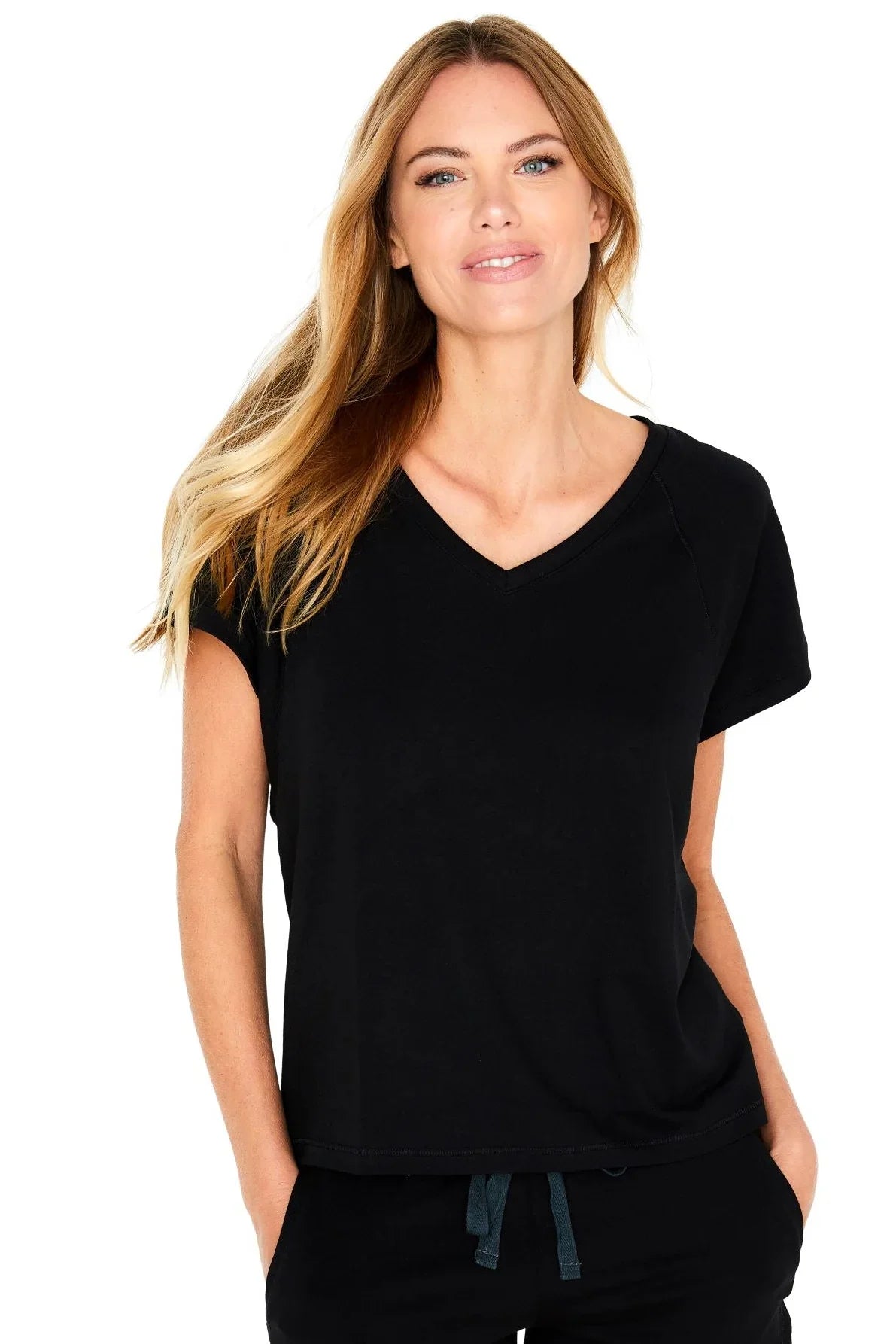 Woman wearing black V-neck Pima cotton loungewear tee and relaxed pants