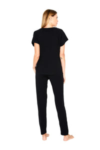 Back view of woman in black Pima cotton loungewear set, short sleeve top and pants