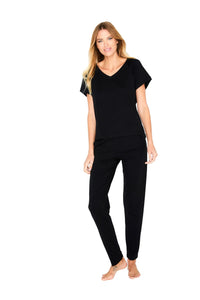 Woman wearing black Pima cotton loungewear set with V-neck top and pants