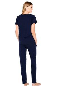 Woman wearing midnight blue Pima cotton loungewear set, short sleeve top and pants, back view