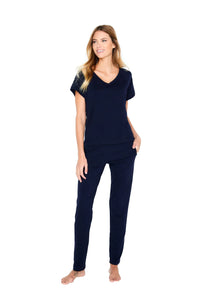 Woman wearing midnight blue Pima cotton loungewear set with short sleeves and pants